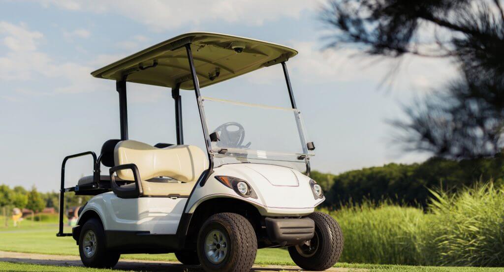 White Golf Cart in green yard (2)