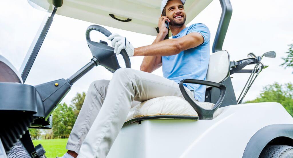 Man calling inside golf cart